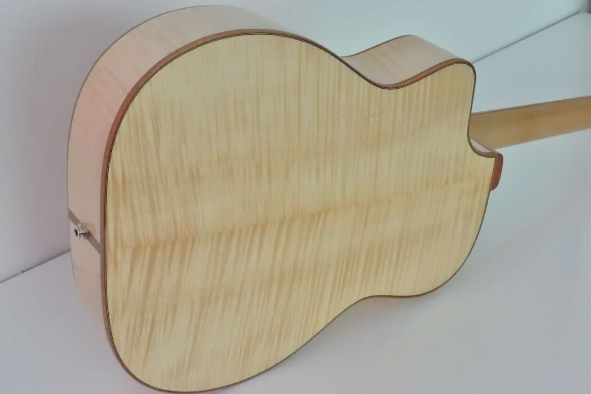 Back is flamed maple. Natural 